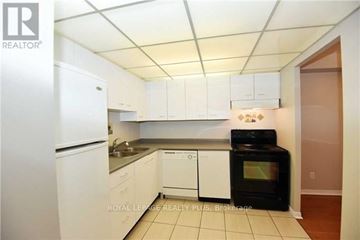 Mississauga (Cooksville) condo for rent - A kitchen with white cabinets and appliances is for sale.