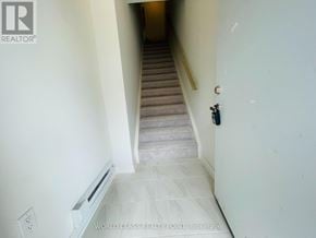 Mississauga (Erin Mills) townhouse for rent - A staircase with a light switch on the wall.