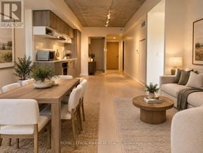 Toronto (Mount Pleasant West) condo for rent - A well-lit, modern dining area with a wooden table and chairs.