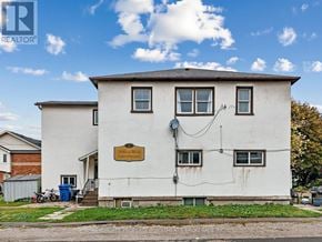 East Gwillimbury (Holland Landing) multi-family for rent - A white house with a brown sign on the front.