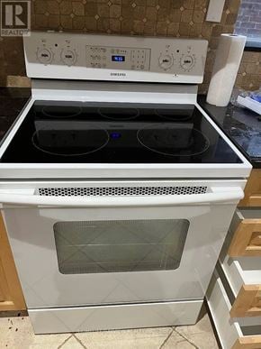 Toronto (Dovercourt-Wallace Emerson-Junction) apartment for rent - A white oven with a digital display and control panel on top.