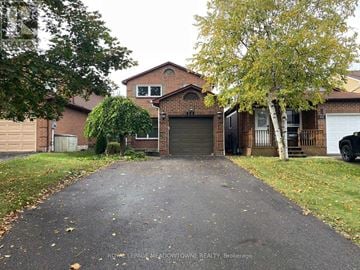 Milton (Bm Bronte Meadows) apartment for rent - A brick house with a driveway in front.
