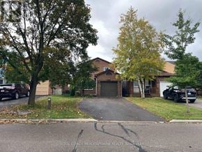 Milton (Bm Bronte Meadows) apartment for rent - A residential area with a house, trees, and parked cars.