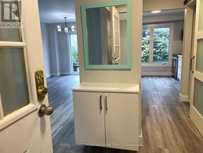 Milton (Bm Bronte Meadows) apartment for rent - A white cabinet with a mirror above it in a room.