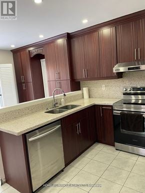 Brampton (Sandringham-Wellington) apartment for rent - A kitchen with brown cabinets and stainless steel appliances.