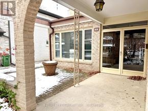 Toronto (Bayview Woods-Steeles) apartment for rent - A patio area with a stone pillar and a planter.