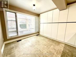 Toronto (Bayview Woods-Steeles) apartment for rent - A room with a large window and a tiled floor.