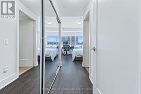 Toronto (Waterfront Communities) condo for rent - A brokerage sign is on the wall of a bedroom.