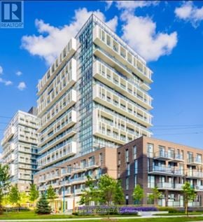 Toronto (Don Valley Village) condo for rent - A tall building with many windows and balconies is shown in the image.