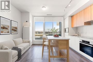 Toronto (Banbury-Don Mills) condo for rent - A well-lit kitchen and living room with a dining table and chairs.