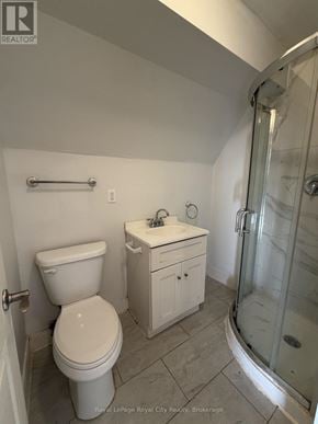 Guelph (Exhibition Park) apartment for rent - A white toilet sits next to a sink in a bathroom.