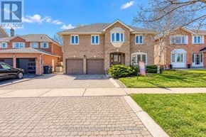 Brampton (Heart Lake West) apartment for rent - A large house with a driveway in front of it.