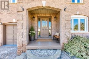 Brampton (Heart Lake West) apartment for rent - A house entrance with a brick wall and a wooden door.