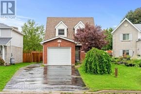 Cambridge apartment for rent - A house with a red brick chimney and a white garage door.