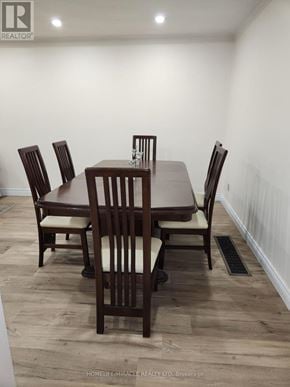 Toronto (Glenfield-Jane Heights) apartment for rent - A brown wooden dining table with four chairs.