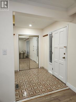 Toronto (Glenfield-Jane Heights) apartment for rent - A hallway with a tiled floor and a white door.