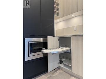 North Vancouver apartment for rent - A modern kitchen with a stainless steel oven and a white countertop.
