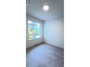North Vancouver apartment for rent - A room with a window and wooden floor.