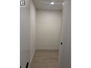 North Vancouver apartment for rent - A hallway with a wooden floor and white walls.