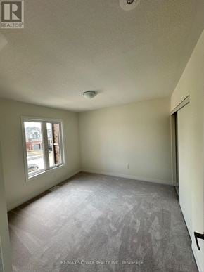 North Dumfries townhouse for rent - A room with a window and a door.