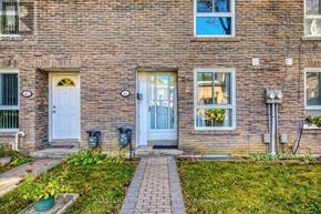 Toronto (Bayview Village) townhouse for rent - A brick building with a white door and windows.