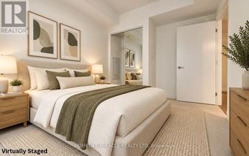 Toronto (Kensington-Chinatown) condo for rent - A modern kitchen with white cabinets and a wooden floor.