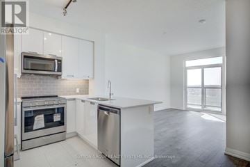 Mississauga (Hurontario) condo for rent - A kitchen with white cabinets and a stainless steel dishwasher.