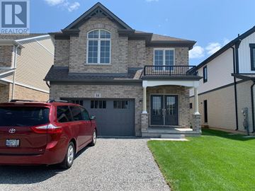 Thorold (Hurricane/Merrittville) apartment for rent - A red car is parked in front of a house with a garage.