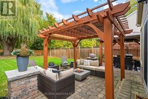 Niagara-On-The-Lake (Town) apartment for rent - A patio with a pergola and a fire pit.