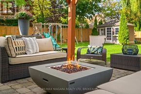 Niagara-On-The-Lake (Town) apartment for rent - A patio with a fire pit and seating area.