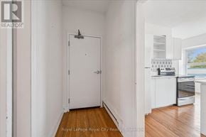 Centre Wellington (Elora/Salem) apartment for rent - A white door is in a room with wooden floors.