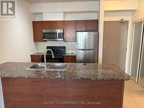 Mississauga (City Centre) condo for rent - A kitchen with granite countertops and stainless steel appliances.