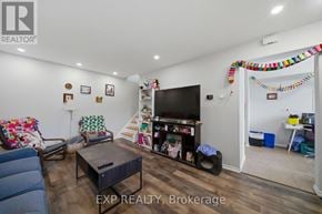 Ottawa townhouse for rent - A living room with a couch, coffee table, and television.