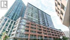 Toronto (Niagara) condo for rent - A tall building with the words "Intercity REALTY INC. Brokerage" on its facade.