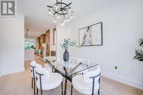 Burlington (Lasalle) apartment for rent - A dining room with a glass table and white chairs.