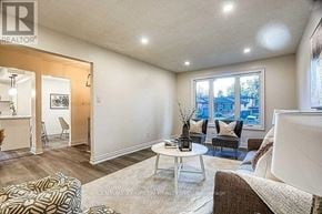 Hamilton (Gilkson) apartment for rent - A well-lit living room with a large window and a view of the outside.
