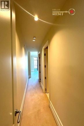 West Vancouver apartment for rent - A long hallway with a sign that says "Hello Rent".