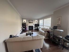 Surrey apartment for rent - A living room with a white couch and a coffee table.