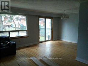 Toronto (Woburn) apartment for rent - A room with a couch and a window.
