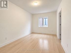 Oshawa (Kedron) apartment for rent - A room with a window and wooden flooring.