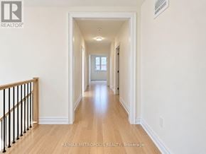 Oshawa (Kedron) apartment for rent - A long hallway with a light at the end.