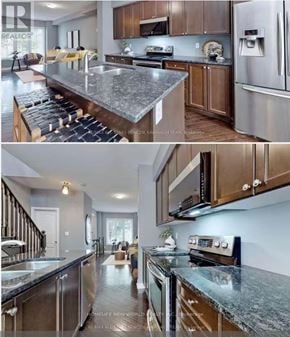 Markham (Cornell) townhouse for rent - A modern kitchen with granite countertops and stainless steel appliances.