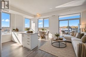 Richmond Hill (Jefferson) condo for rent - A well-lit, spacious living room with a kitchen area in the background.