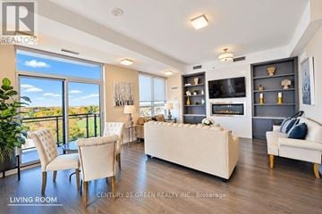 Richmond Hill (Jefferson) condo for rent - A living room with a white couch and a television on a black stand.