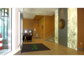 West Vancouver apartment for rent - A reception area with a green doormat and a wooden staircase.