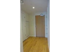 West Vancouver apartment for rent - A hallway with a wooden floor and white walls.