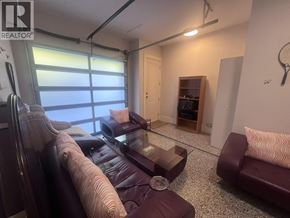 West Vancouver apartment for rent - A living room with a couch, a chair, and a coffee table.