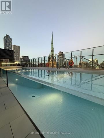 Toronto (Church-Yonge Corridor) condo for rent - A pool with a cityscape in the background.