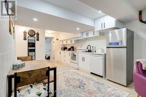Stratford apartment for rent - A kitchen with a refrigerator, oven, and microwave.