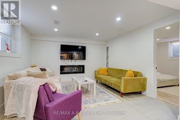 Stratford apartment for rent - A living room with a purple chair and a yellow couch.